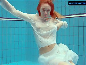 red-haired Diana molten and crazy in a milky sundress